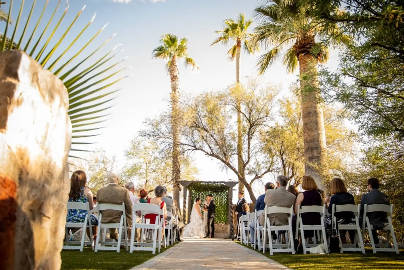 Golden hour wedding ceremony at Oasis at Wild Horse Ranch, Tucson wedding vendors guide